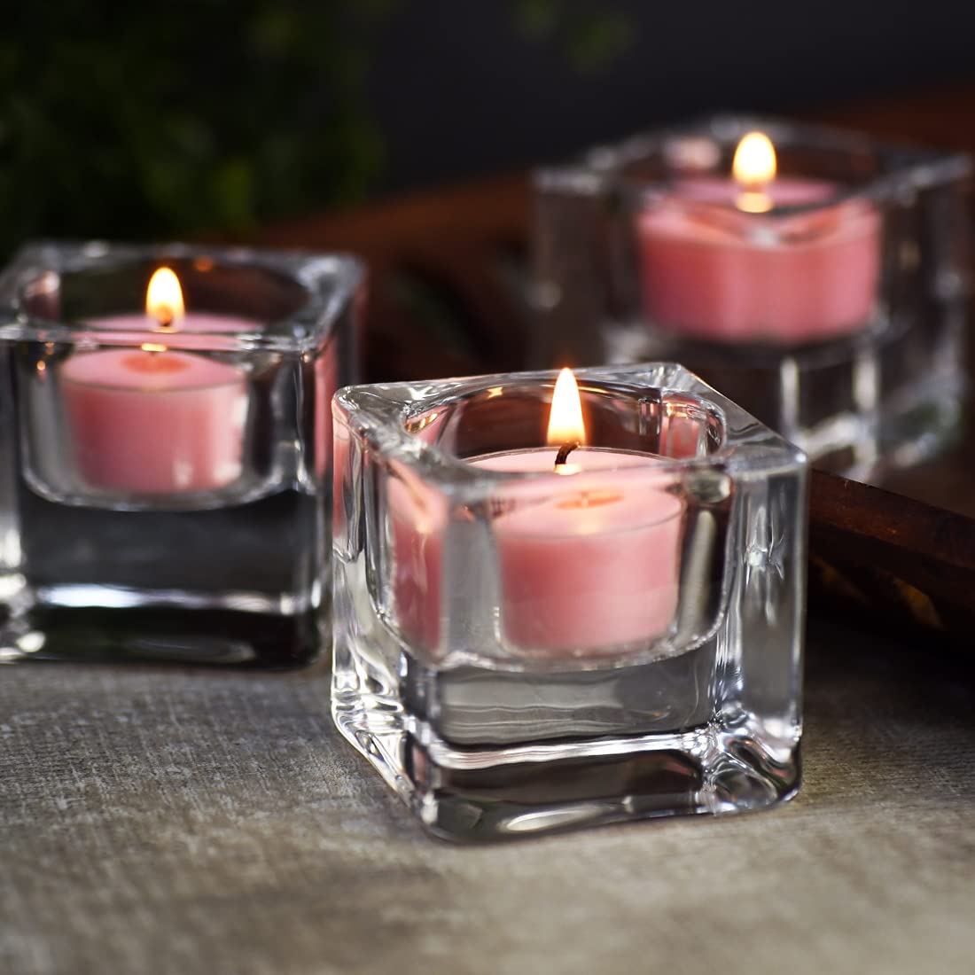 Elegant table decor with rose scented tealight candles