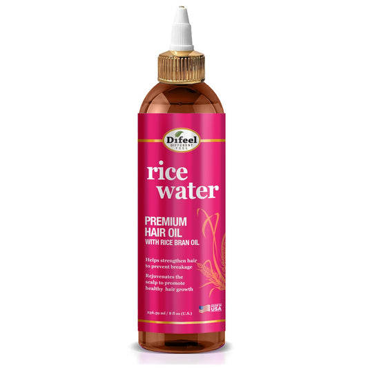 Difeel Rice Water Hair Oil bottle pouring for even application and coverage.