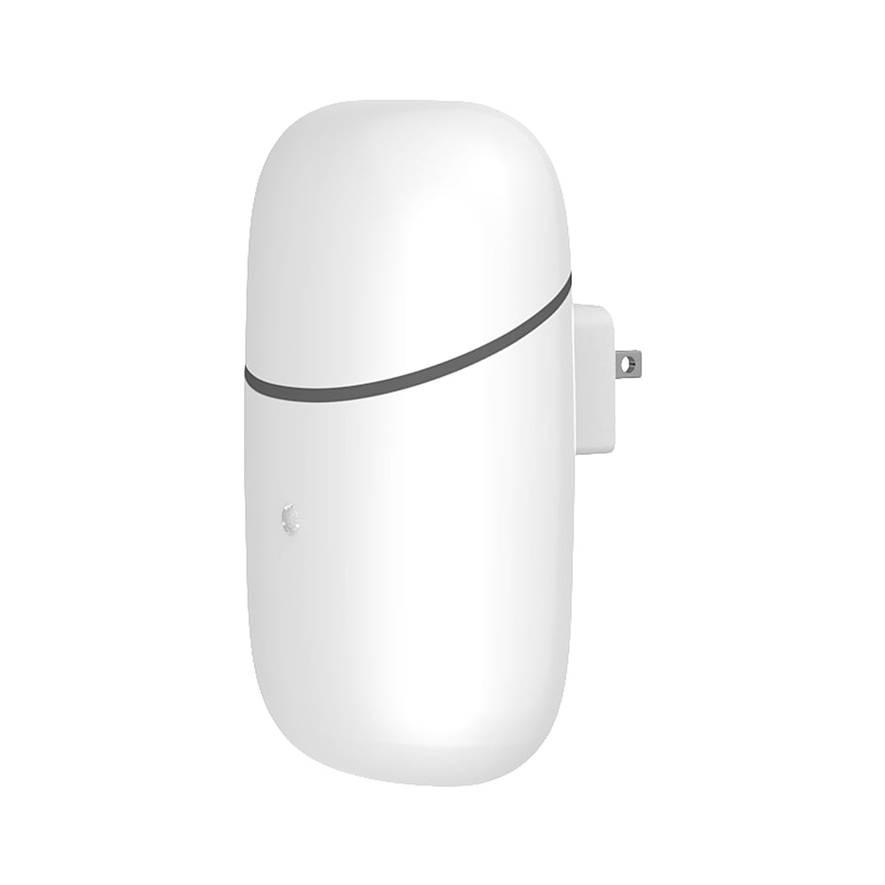 In-use diffuser in dim room with night light