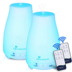 Close-up of two Diffuserlove diffusers with remote and accessories