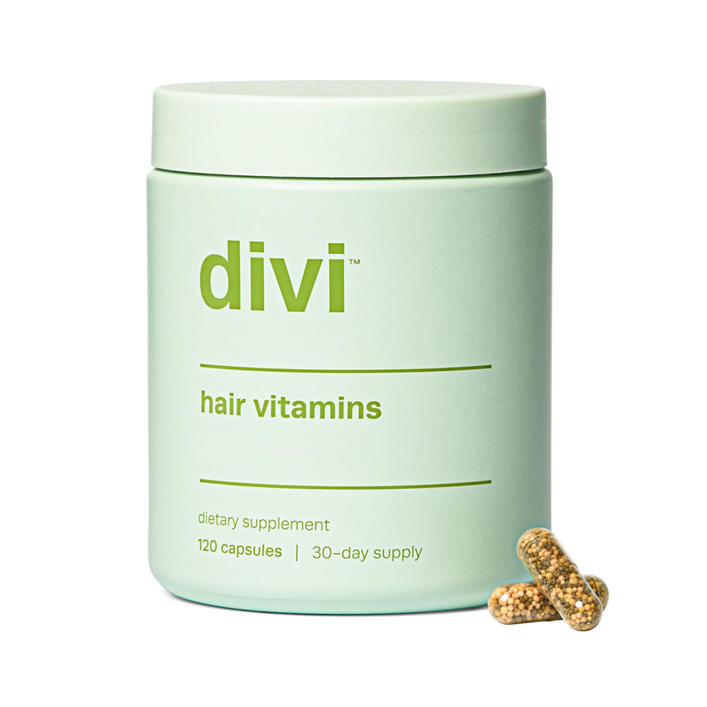 Divi Hair Vitamins bottle and capsules on white background