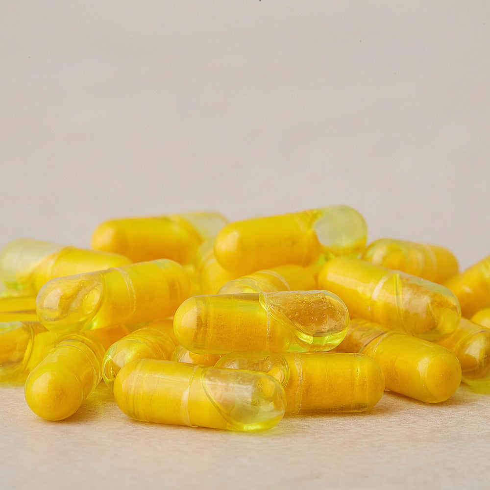 Close-up of doTERRA Turmeric Dual Chamber Capsules packaging highlighting CPTG certification
