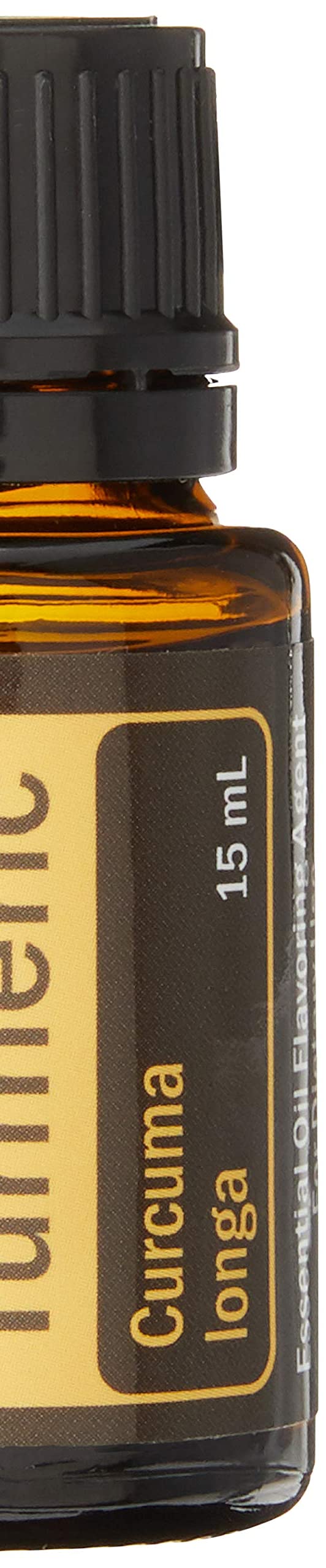 Turmeric roots with a bottle of Turmeric Essential Oil