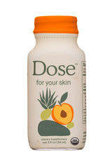 Glass with Dose for Skin Shot surrounded by tropical berries