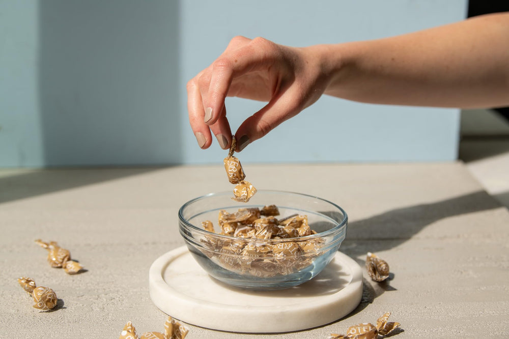 doTERRA Ginger Throat Drops in travel setting for occasional nausea relief.