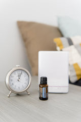 Peppermint oil bottle with dropper on white background