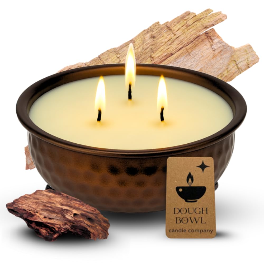 Dough Bowl Candle Co. Mahogany Teakwood candle in a bronze firepit-style container.