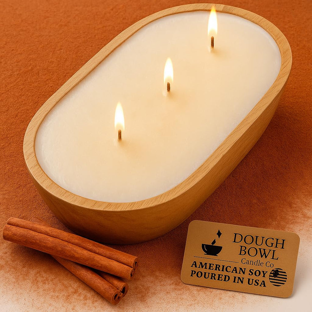 Three-wick soy candle in a mango wood dough bowl with warm cinnamon buns scent
