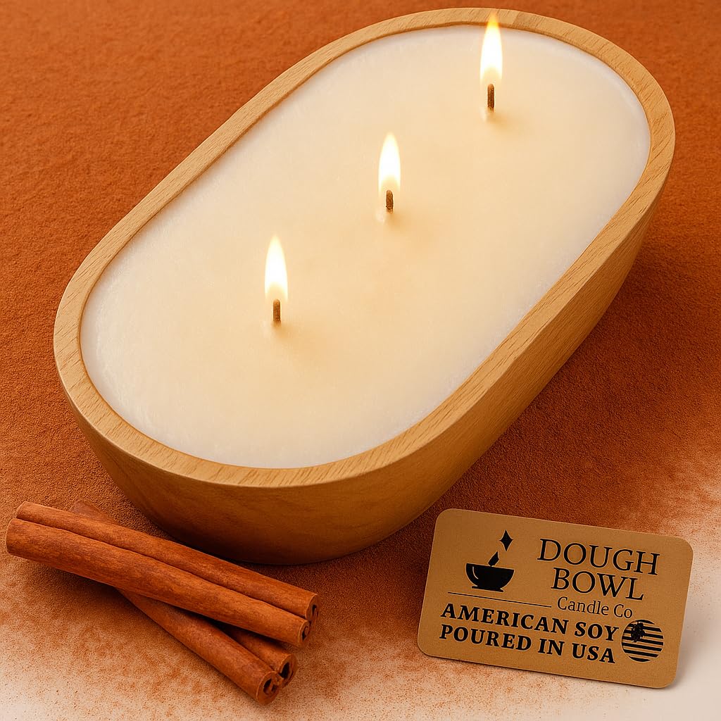 Three-wick soy candle in a mango wood dough bowl with warm cinnamon buns scent