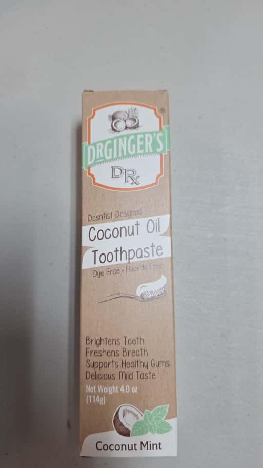 Product packaging showcasing fluoride-free formula and natural ingredients