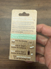 Three-pack packaging of Dr. Ginger's White Charcoal Dental Floss