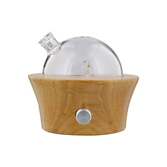 Dr. Mercola dry aroma diffuser base in blond beechwood for subtle room aromatherapy.