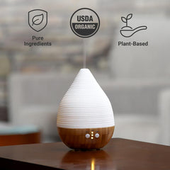 Dr. Mercola Ola Botanicals diffuser scene emphasizing uplifting lemon aroma.