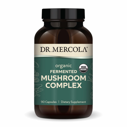 Dr. Mercola Organic Fermented Mushroom Complex bottle on countertop