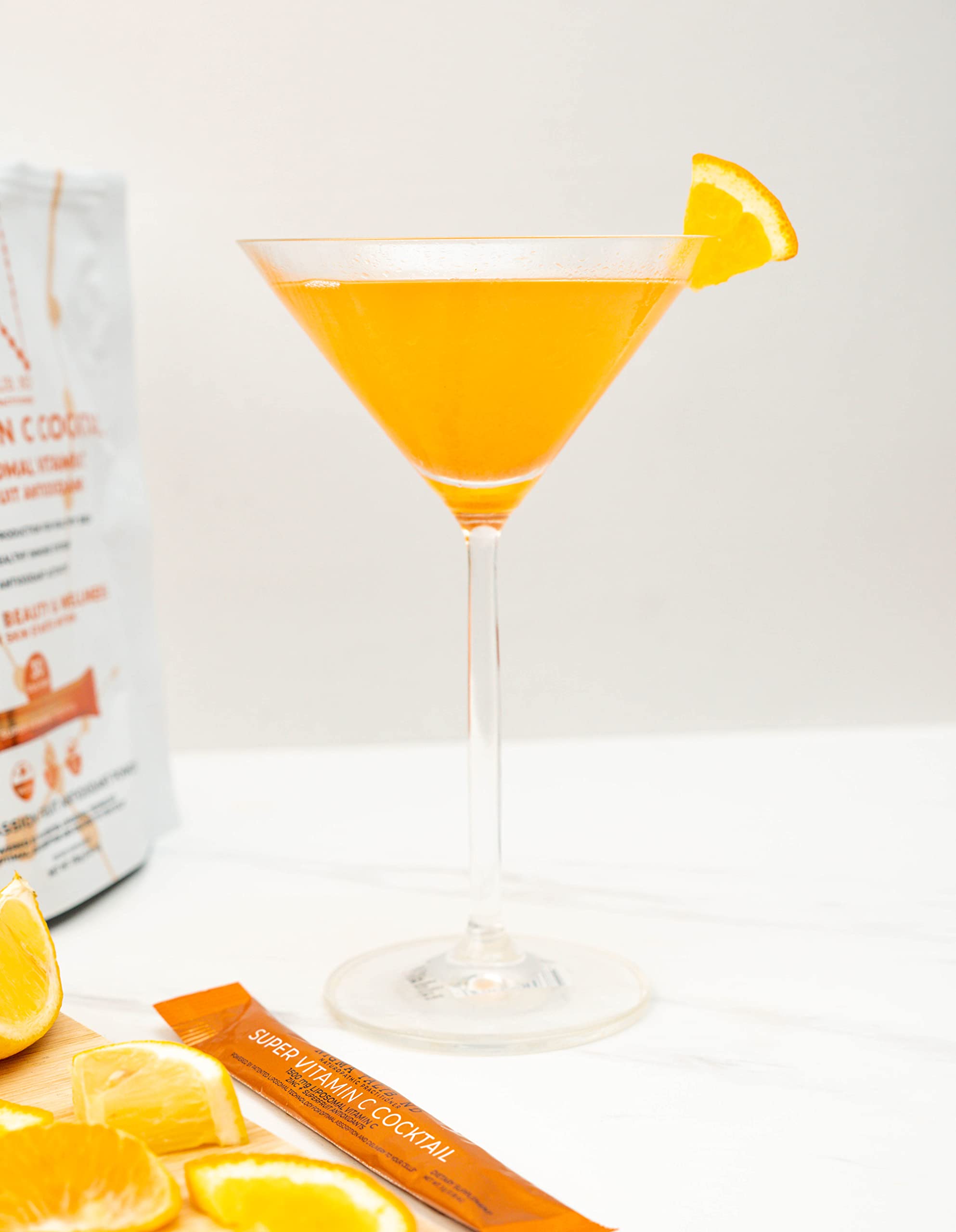 Lifestyle shot of DR. NIGMA Vitamin C Cocktail prepared in a glass