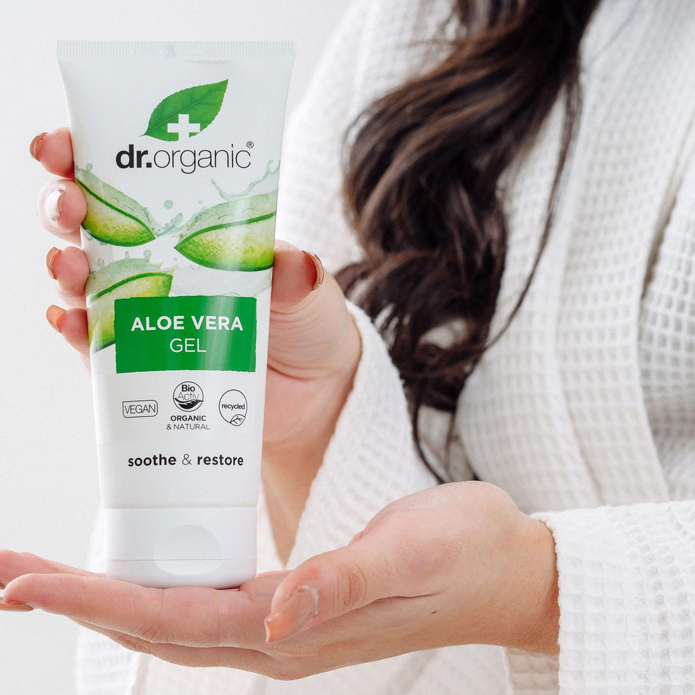 Hands applying Dr Organic Aloe Vera Gel 200ml