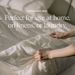 Aromatherapy spray being misted on a pillow and linens