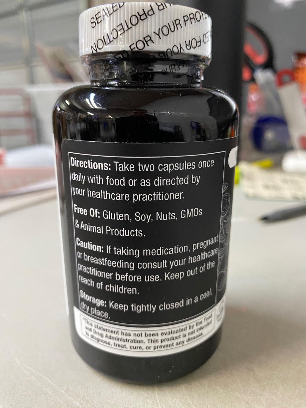 Capsules beside Durable Heart bottle with branding