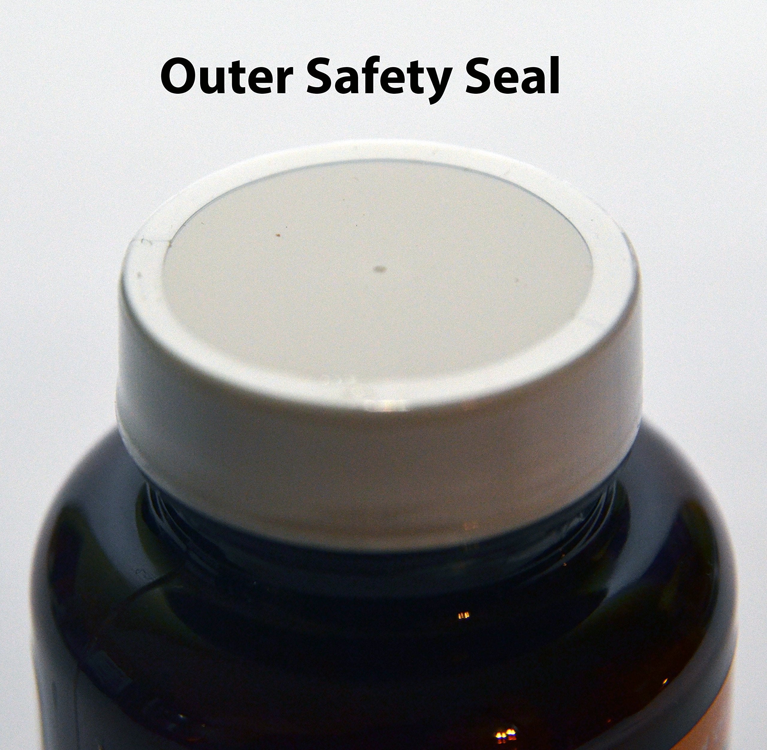 Side view of Queen's Delight bottle on a wooden surface
