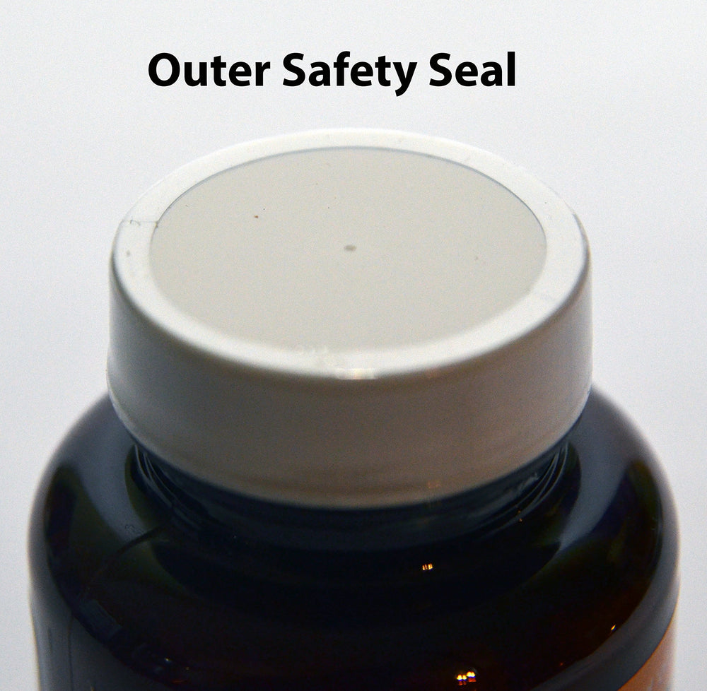 Side view of Queen's Delight bottle on a wooden surface
