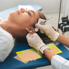 Disposable ear seed stickers mounted on a sheet