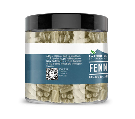 Close-up of fennel seed capsules next to bottle