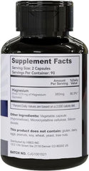 Close-up of magnesium glycinate capsules inside bottle