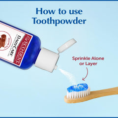 Essential oils bottle beside toothpowder jar