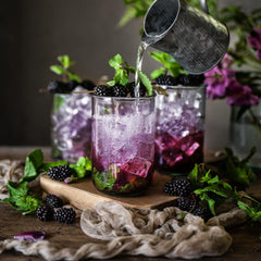 Powder being mixed into a smoothie or drink