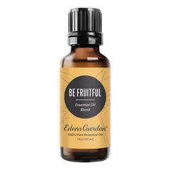 Be Fruitful essential oil blend bottle with citrus fruits in the background