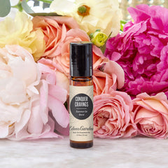 Close-up of Edens Garden Conquer Cravings roll-on bottle