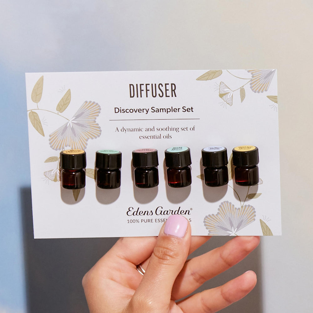 Close-up of Edens Garden essential oil bottles