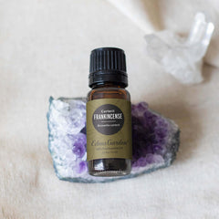 Amber glass bottle with dropper containing frankincense oil