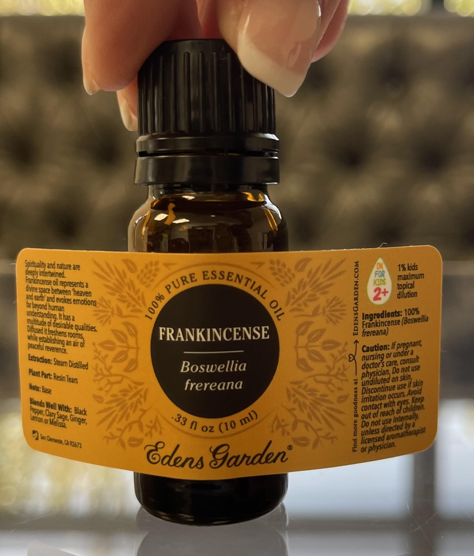 Edens Garden logo with Frankincense Frereana essential oil bottle