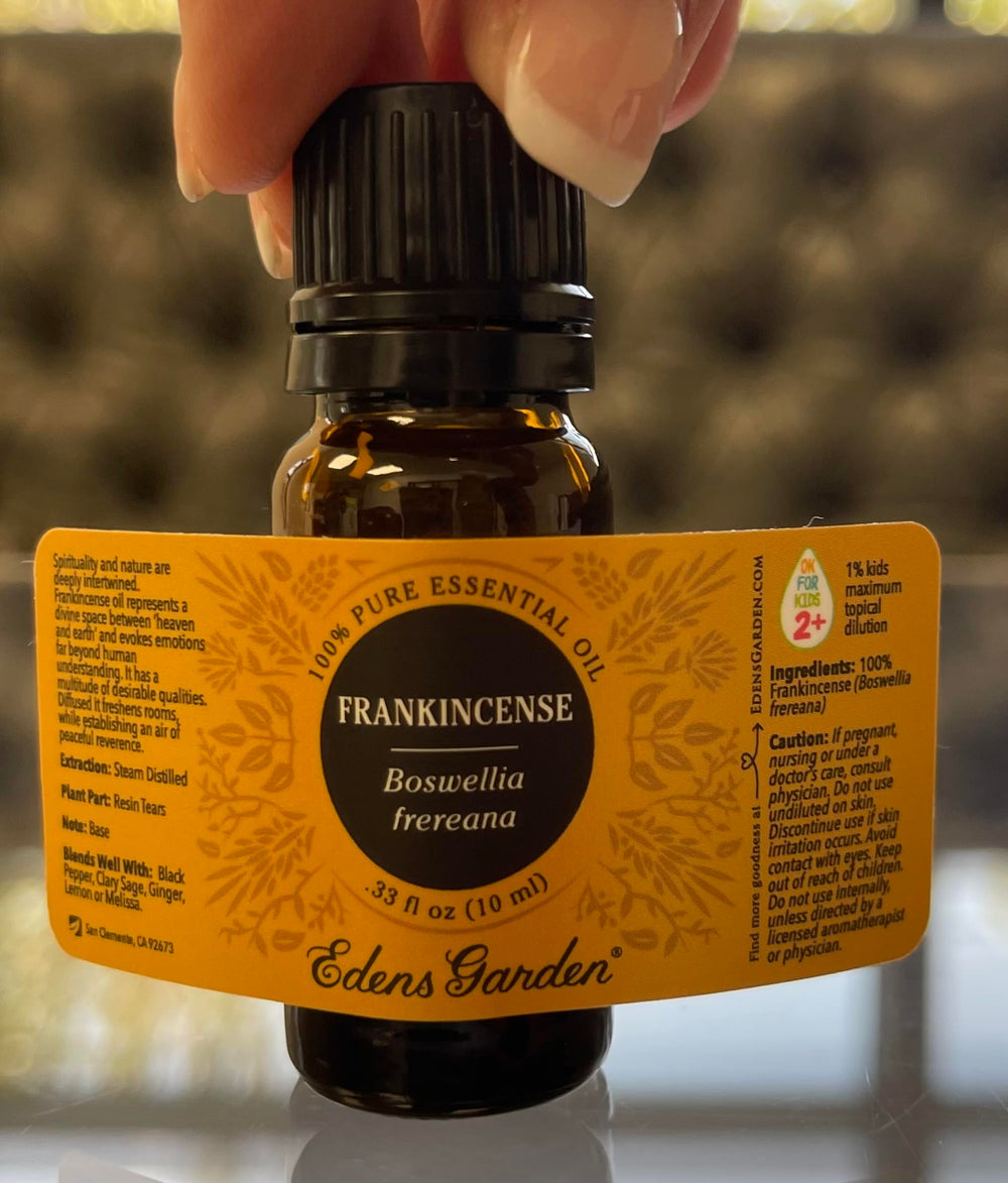 Edens Garden logo with Frankincense Frereana essential oil bottle