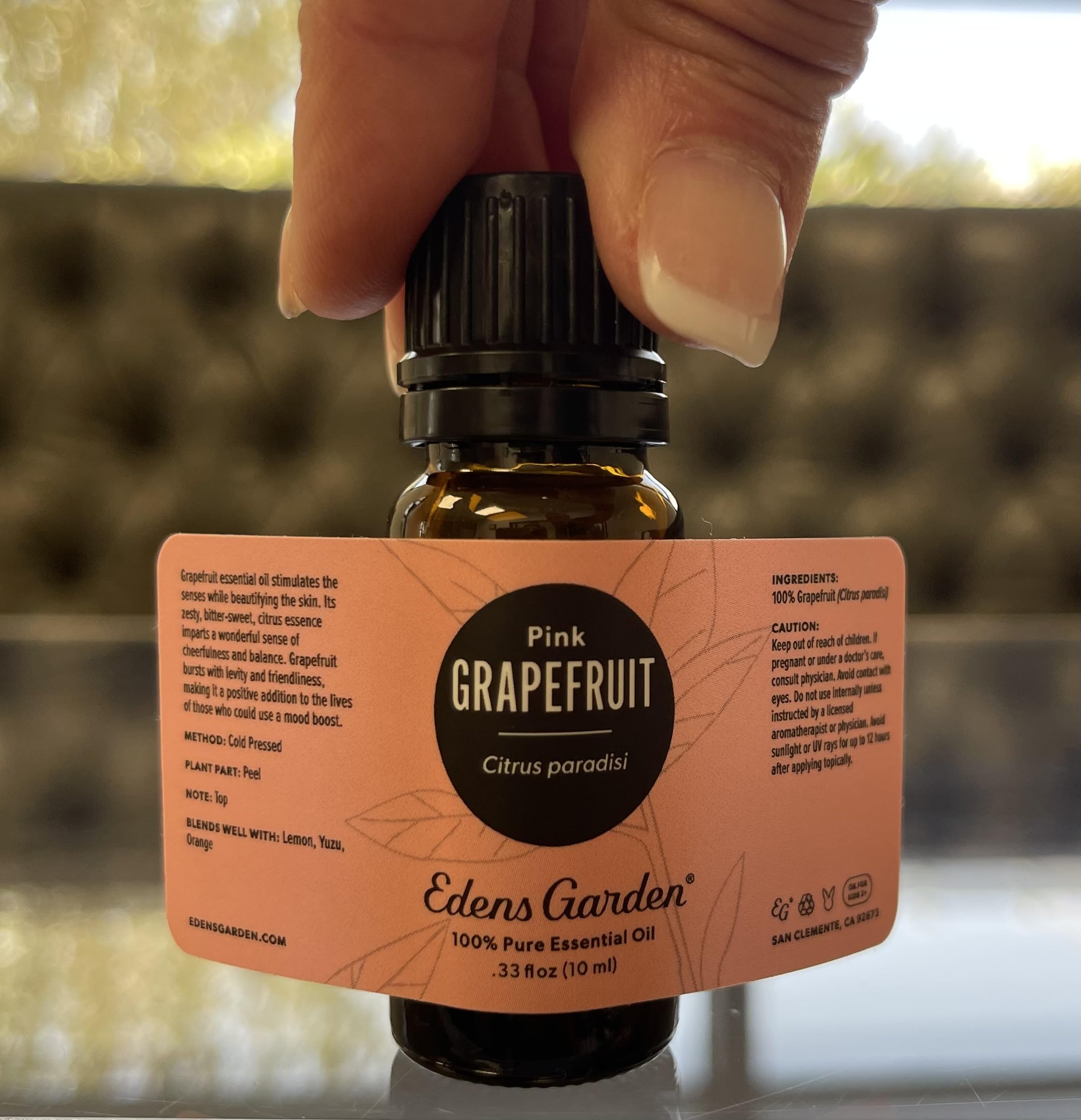 Wooden diffuser with Grapefruit Pink essential oil in setup
