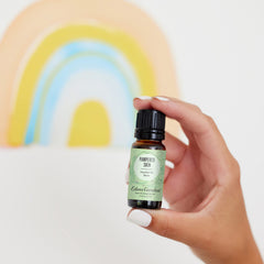 Close-up of Edens Garden essential oil bottle