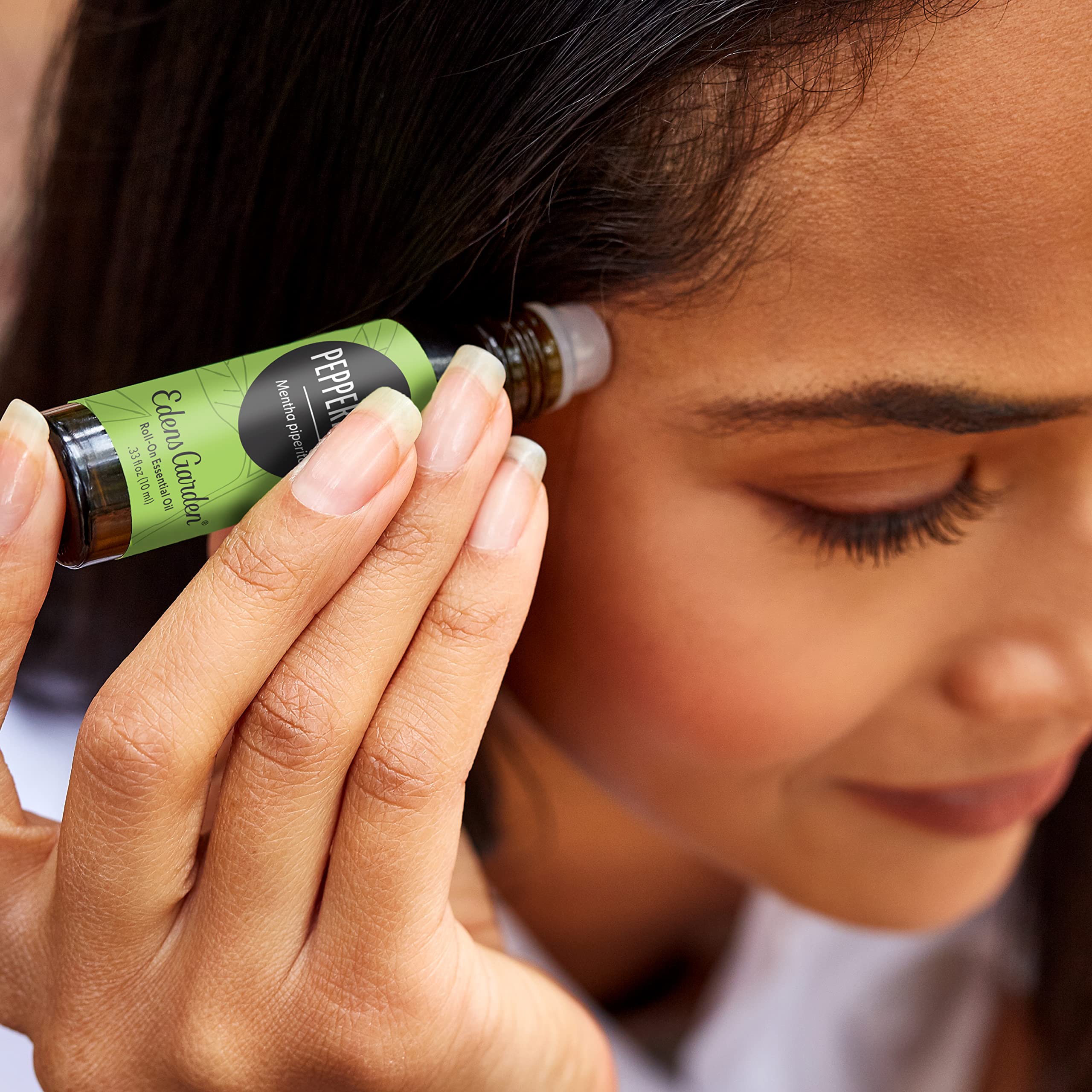 Close-up of peppermint essential oil roll-on bottle