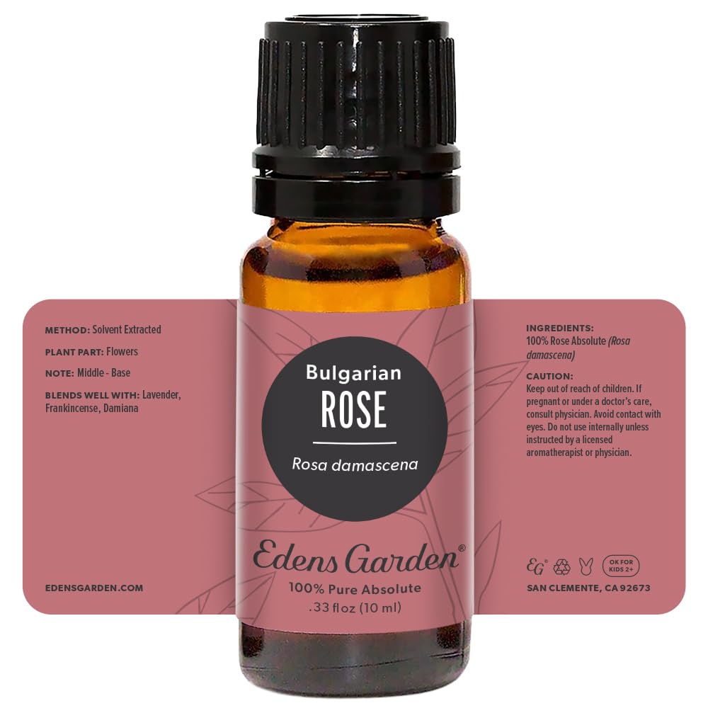 10 mL bottle of Rose Bulgarian Absolute Essential Oil on wooden surface