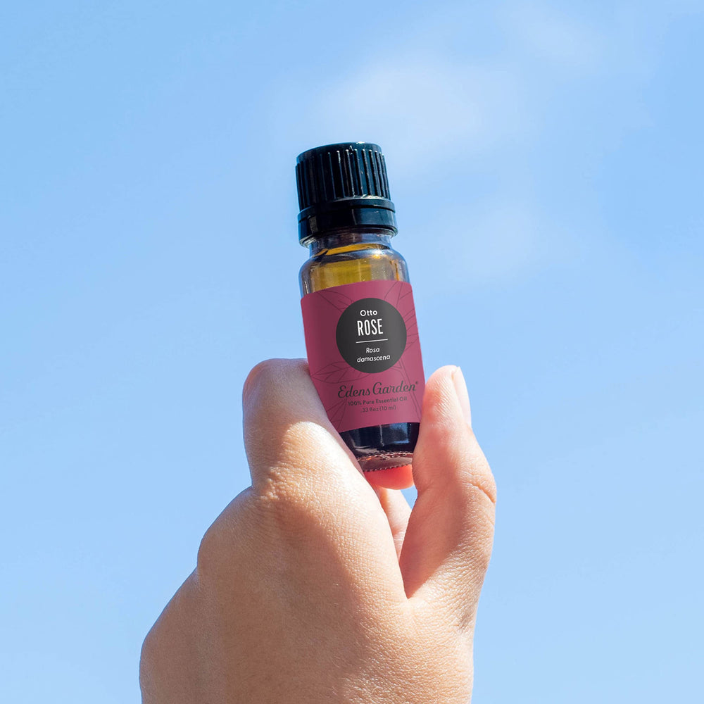 Amber glass bottle with Rose Otto essential oil label