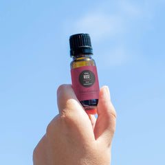 Amber glass bottle with Rose Otto essential oil label