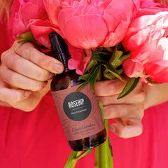 Amber glass bottle of Edens Garden Rosehip Oil