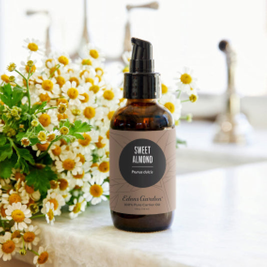 Close-up of Edens Garden Sweet Almond Carrier Oil bottle