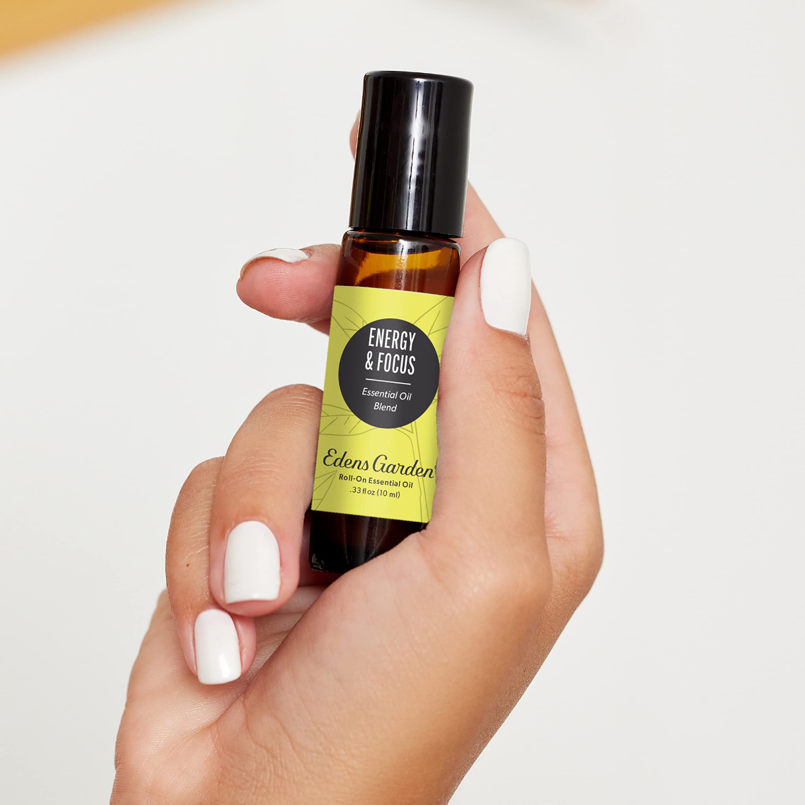 Close-up of the label showing 100% pure essential oil and premium grade