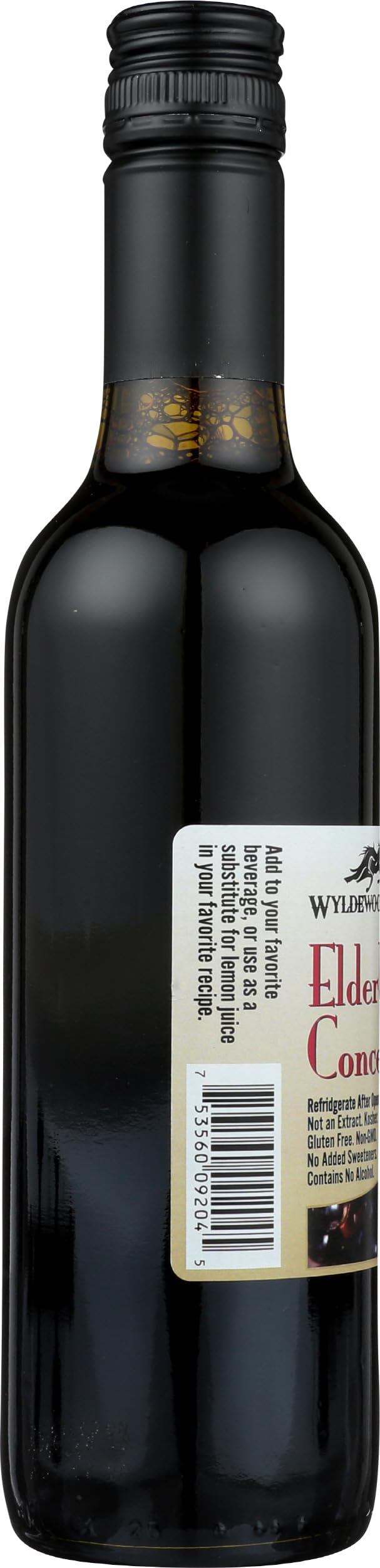 Pouring elderberry juice concentrate into a glass