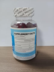 Gummies arranged next to bottle on white background