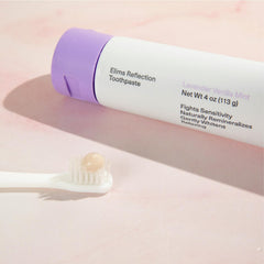 Elims toothpaste being used by adult and child