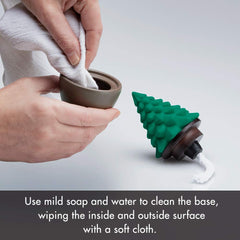 Ellia diffuser rests among holiday decor creating fragrant seasonal vibe.