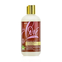 én Love Moisture Crush Shampoo bottle pouring coconut milk for deep hydration.