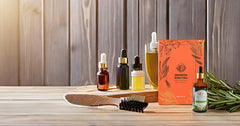 Enhanced Essentials rosemary oil in bath and massage setting conveying calming, invigorating ritual.